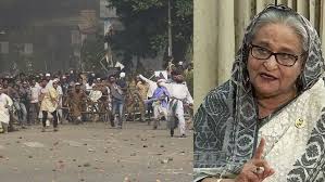 a woman in a headscarf and a group of people in a crowd শাপলা চত্বরে গণহত্যা মামলায় হাসিনাসহ পাঁচজনের বিরুদ্ধে গ্রেপ্তারি পরোয়ানা